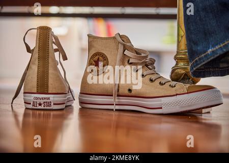 Buenos Aires, Argentina - 09 15 2022: Converse Chuck Taylor all stars sports shoes in canvas fabric make, also known as Chucks sneakers in fawn color Stock Photo
