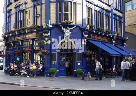 People outside The Shipwrights Arms pub near London Bridge, London England United Kingdom UK Stock Photo