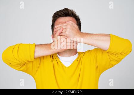 Anonymous caucasian man hiding his identity . Studio shot Stock Photo