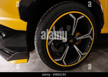 Ternopil, Ukraine- November 11, 2022:  Car wheel of yellow Lamborghini Urus. Stock Photo