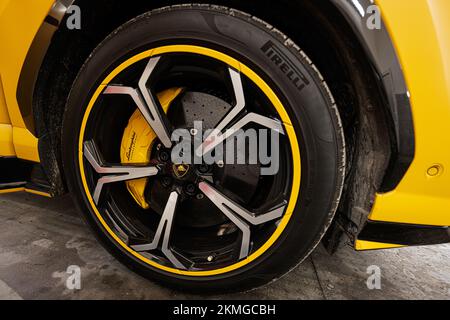 Ternopil, Ukraine- November 11, 2022:  Car wheel of yellow Lamborghini Urus. Stock Photo