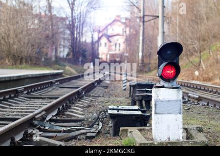 Traffic light shows red signal on railway. Red light Stock Photo