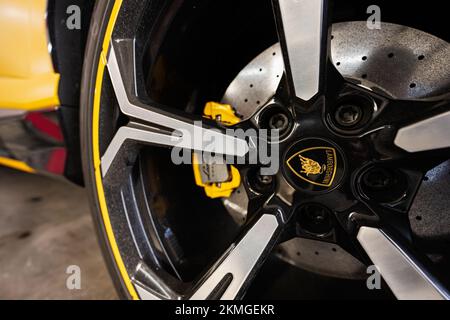 Ternopil, Ukraine- November 11, 2022:  Car wheel of yellow Lamborghini Urus. Stock Photo