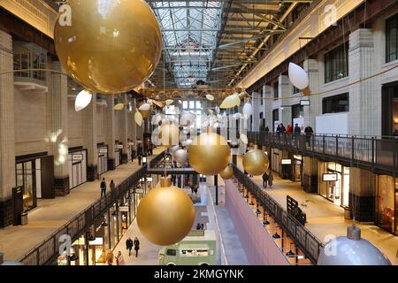 Turbine Hall A in the reopened Battersea Power Station, with stylish Christmas baubles up, in SW London, UK Stock Photo