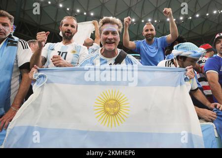 Lusail, Qatar. 26th Nov, 2022. Lusail, Qatar. 27th Nov, 2022. Argentina fans celebrate winning during the FIFA World Cup Qatar 2022 Group C match between Argentina and Mexico at Lusail Stadium, Lusail, Qatar on 26 November 2022. Photo by Peter Dovgan. Editorial use only, license required for commercial use. No use in betting, games or a single club/league/player publications. Credit: UK Sports Pics Ltd/Alamy Live News Stock Photo