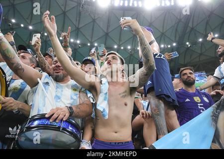 Lusail, Qatar. 26th Nov, 2022. Lusail, Qatar. 27th Nov, 2022. Argentina fans celebrate winning during the FIFA World Cup Qatar 2022 Group C match between Argentina and Mexico at Lusail Stadium, Lusail, Qatar on 26 November 2022. Photo by Peter Dovgan. Editorial use only, license required for commercial use. No use in betting, games or a single club/league/player publications. Credit: UK Sports Pics Ltd/Alamy Live News Stock Photo