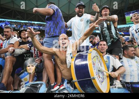 Lusail, Qatar. 26th Nov, 2022. Lusail, Qatar. 27th Nov, 2022. Argentina fans celebrate winning during the FIFA World Cup Qatar 2022 Group C match between Argentina and Mexico at Lusail Stadium, Lusail, Qatar on 26 November 2022. Photo by Peter Dovgan. Editorial use only, license required for commercial use. No use in betting, games or a single club/league/player publications. Credit: UK Sports Pics Ltd/Alamy Live News Stock Photo