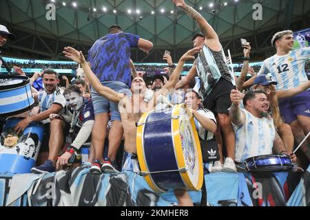 Lusail, Qatar. 26th Nov, 2022. Lusail, Qatar. 27th Nov, 2022. Argentina fans celebrate winning during the FIFA World Cup Qatar 2022 Group C match between Argentina and Mexico at Lusail Stadium, Lusail, Qatar on 26 November 2022. Photo by Peter Dovgan. Editorial use only, license required for commercial use. No use in betting, games or a single club/league/player publications. Credit: UK Sports Pics Ltd/Alamy Live News Stock Photo