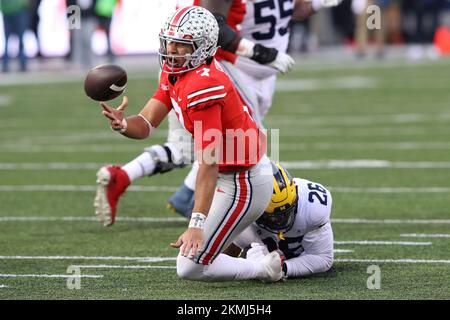 Columbus, United States. 26th Nov, 2022. Ohio State Buckeyes quarterback C.J. Stroud (7) attempts to throw a pass as he is taken down by Michigan Wolverines Rayshaun Benny (26) in the fourth quarter in Columbus, Ohio on Saturday, November 26, 2022. Photo by Aaron Josefczyk/UPI Credit: UPI/Alamy Live News Stock Photo