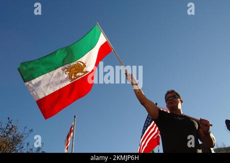 Washington DC, USA. 26 Nov 2022. Flag-waving demonstrators gathered in Freedom Plaza to support the ongoing anti-government protests in Iran. Credit: Philip Yabut/Alamy Live News Stock Photo