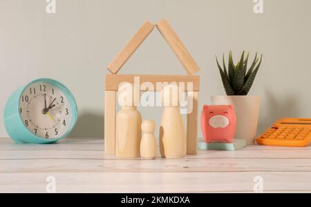Small wooden figures of family members. Family relationship symbol. Stock Photo