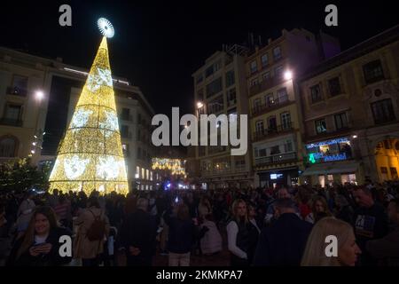 Malaga, Spain. 26th Nov, 2022. People are seen gathered during the switching on of the Christmas lighting at Plaza de la Constitucion square. Amid energy crisis and the increase of price electricity, Malaga city turns on its Christmas lights to mark the Christmas season, where thousands of people gather in downtown city to see a new Christmas decoration and lights show. (Credit Image: © Jesus Merida/SOPA Images via ZUMA Press Wire) Stock Photo