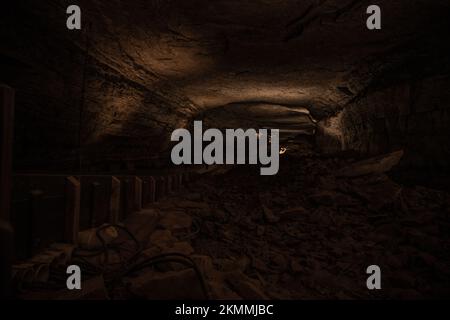 Lights Highlight The Tall Hallway of Mammoth Cave National Park's Natural Entrance Stock Photo