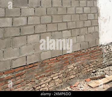 Construction site wall repair, foundation restoration. Stock Photo