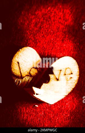 Book cover conceptual on a crushed love heart decorated, split in two. A breakdown in romance Stock Photo