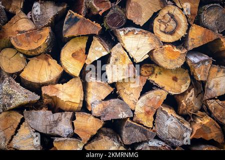 A stack of firewood to keep the fire going to keep warm during winter. Stock Photo