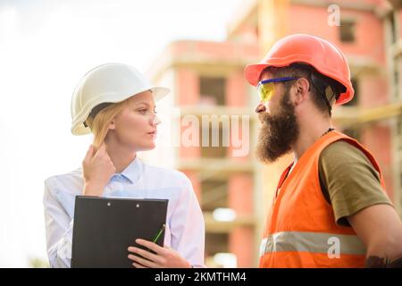 Purchase of building materials. Construction industry. Successful deal concept. Foreman established supply of building materials. Expert and builder Stock Photo