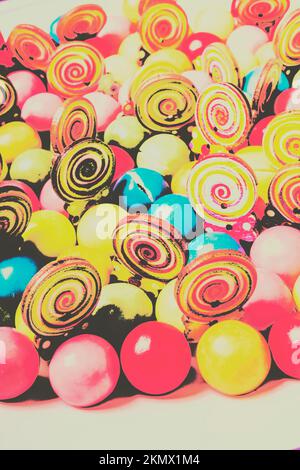 Pop art style photograph on a vibrant assortment of candy gums and lolly pops. Retro confectionery