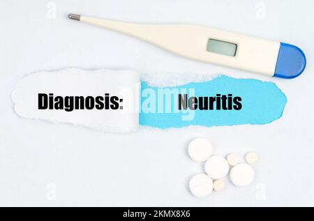 Medical diagnosis. A gap is made in the middle of the white sheet, inside of which there is an inscription - Neuritis on a blue background. On the she Stock Photo