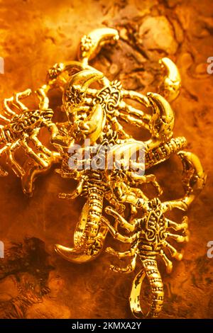 Egyptian style art on golden scorpion treasures made from ancient gold. From the pharaohs tomb Stock Photo