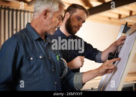 Turning his vision into reality. An architect drawing up plans. Stock Photo