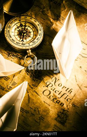 Maritime sailors still life art on plotting maps from swaying compasses. A pacific route Stock Photo