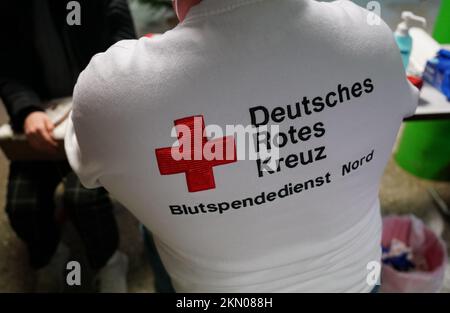 Berlin, Germany. 24th Sep, 2020. A Hertha jersey is held up to the camera  at a press conference. With the footprints of an eight-month-old girl and  the lettering for Pauline on the