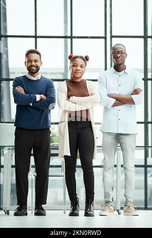 confident young business people standing in the office . Stock Photo