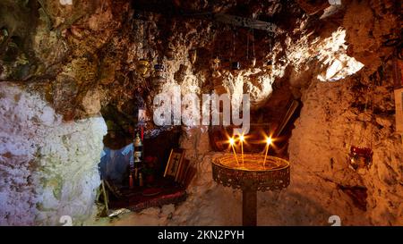 Cave Church of Agios Gerasimos, candlestick, burning candles, star effect, icons, Kefalonia Island, Ionian Islands, Greece, Europe Stock Photo
