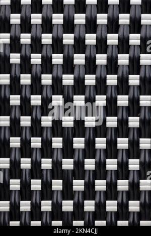 BACKGROUND TEXTURE -  Woven black and white plastic strips Stock Photo