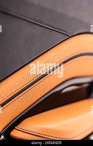 A vertical closeup of Aston Martin Vantage brown leather and black Alcantara interior Stock Photo