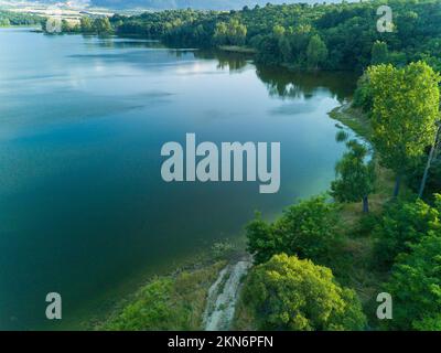 Professional breeding of freshwater fish in intermountain blue lake with round nets. Cloudy weather, Rhodope mountains, Europe Stock Photo