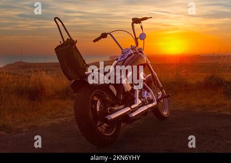 Harley-Davidson Motorcycle at Sunset Stock Photo