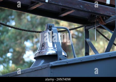 A Silver Warning Bell on a Vintage Fire Engine Vehicle. Stock Photo