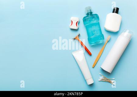 Composition with bath cosmetics on table. razor, toothpaste, soap, gel, toothbrush, mouthwash and other various accessories. Cosmetics for skin health Stock Photo