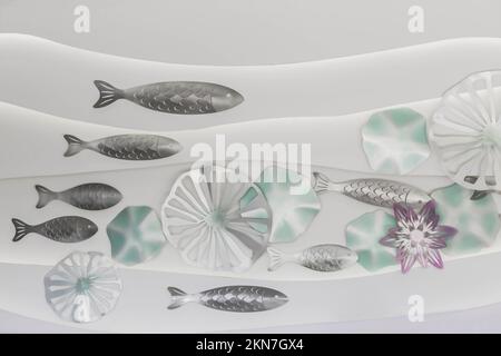 Marine background. Cardboard fish on the wall in the children's room Stock Photo