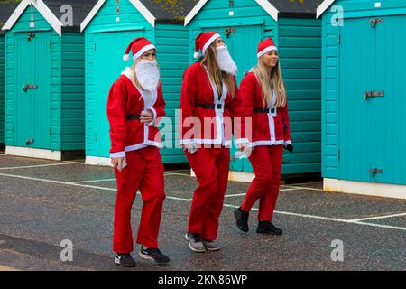 Bournemouth, Dorset UK. 27th November 2022. Supporters of Julias House, a local childrens hospice charity, dress in their Santa suits to run, or walk, the 5km Santa Dash from Bournemouth Pier along the seafront at Bournemouth, raising funds for the charity. Credit: Carolyn Jenkins/Alamy Live News Stock Photo