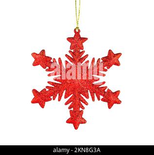 Red snowflake isolated on white background. Shiny Christmas tree toy. Stock Photo