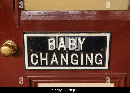 England, Sussex, Bluebell Railway, Sheffield Park Station, Vintage Baby Changing Room Sign Stock Photo