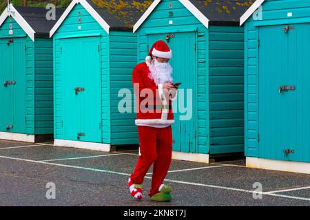 Bournemouth, Dorset UK. 27th November 2022. Supporters of Julias House, a local childrens hospice charity, dress in their Santa suits to run, or walk, the 5km Santa Dash from Bournemouth Pier along the seafront at Bournemouth, raising funds for the charity. Credit: Carolyn Jenkins/Alamy Live News Stock Photo