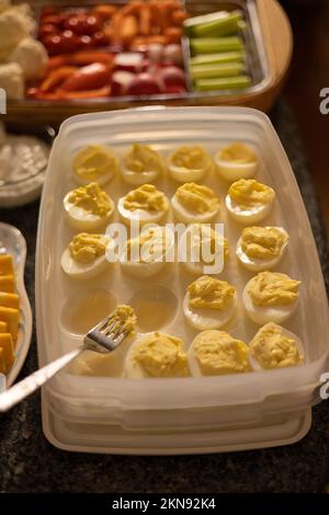 a serving tray of deviled eggs that used to be full Stock Photo