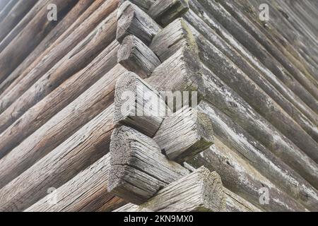 corner of an old log cracked hut Stock Photo