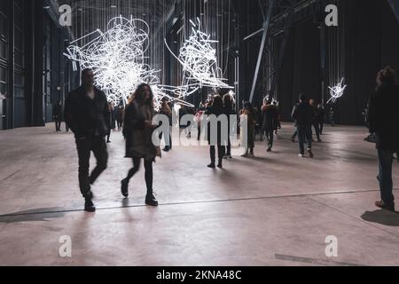 Gas illuminate people meanwhile walking. Milan, italy Stock Photo