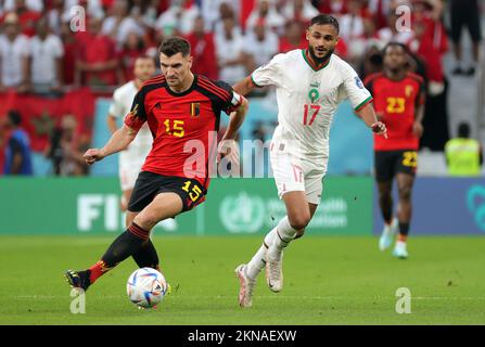 Belgium's Thomas Meunier and Moroccan Sofiane Boufal pictured in action during a soccer game between Belgium's national team the Red Devils and Morocco, in Group F of the FIFA 2022 World Cup in Al Thumama Stadium, Doha, State of Qatar on Sunday 27 November 2022. BELGA PHOTO VIRGINIE LEFOUR Stock Photo