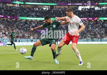 Saleh Al Shehri of Saudi Arabia and Krystian Bielik of Poland during the FIFA World Cup 2022, Group C football match between Poland and Saudi Arabia on November 26, 2022 at Education City Stadium in Doha, Qatar - Photo: Sebastian El-saqqa/DPPI/LiveMedia Stock Photo