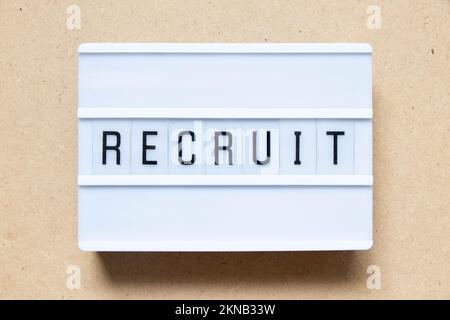 Lightbox with word recruit on wood background Stock Photo