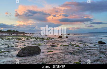 sunset with dramatic cloud sky at Clifton beach in county Galway, western part of the Republic of Ireland Stock Photo