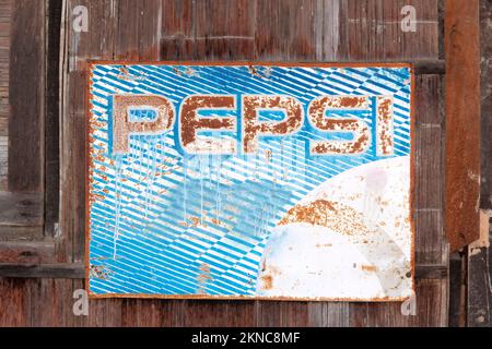 Old rusty sign of Pepsi