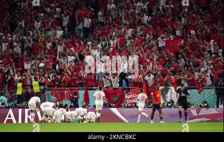 Morocco’s Abdelhamid Sabiri celebrates scoring their side's first goal of the game with team-mates and in front of their fans during the FIFA World Cup Group F match at the Al Thumama Stadium, Doha, Qatar. Picture date: Sunday November 27, 2022. Stock Photo