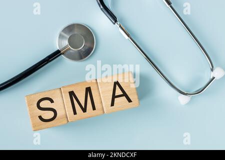 SMA, spinal muscular atrophy, Written on wooden blocks, a rare disease ...